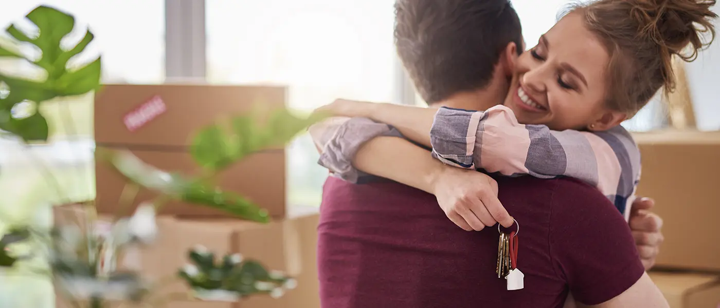 Happy Couple with keys new house